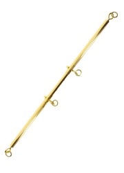 Zoom sur la barre extensible et ses finitions métalliques dorées.