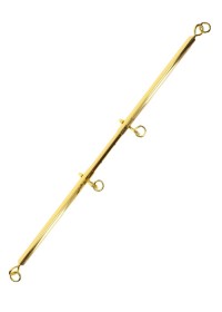 Zoom sur la barre extensible et ses finitions métalliques dorées.